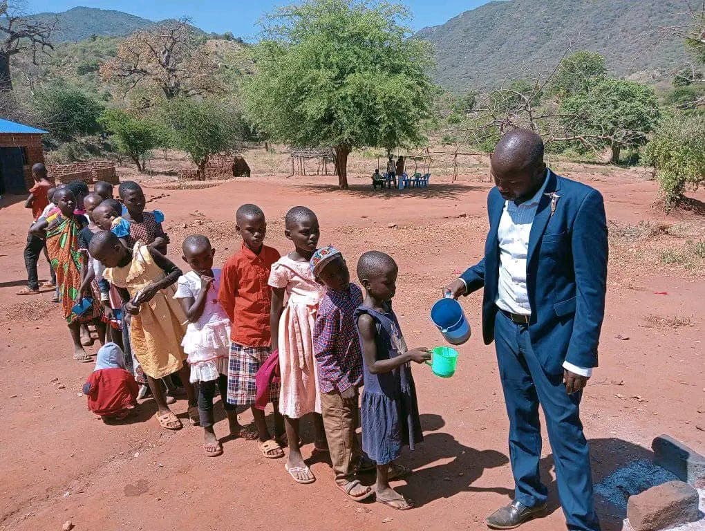 Children receiving water in a rural community